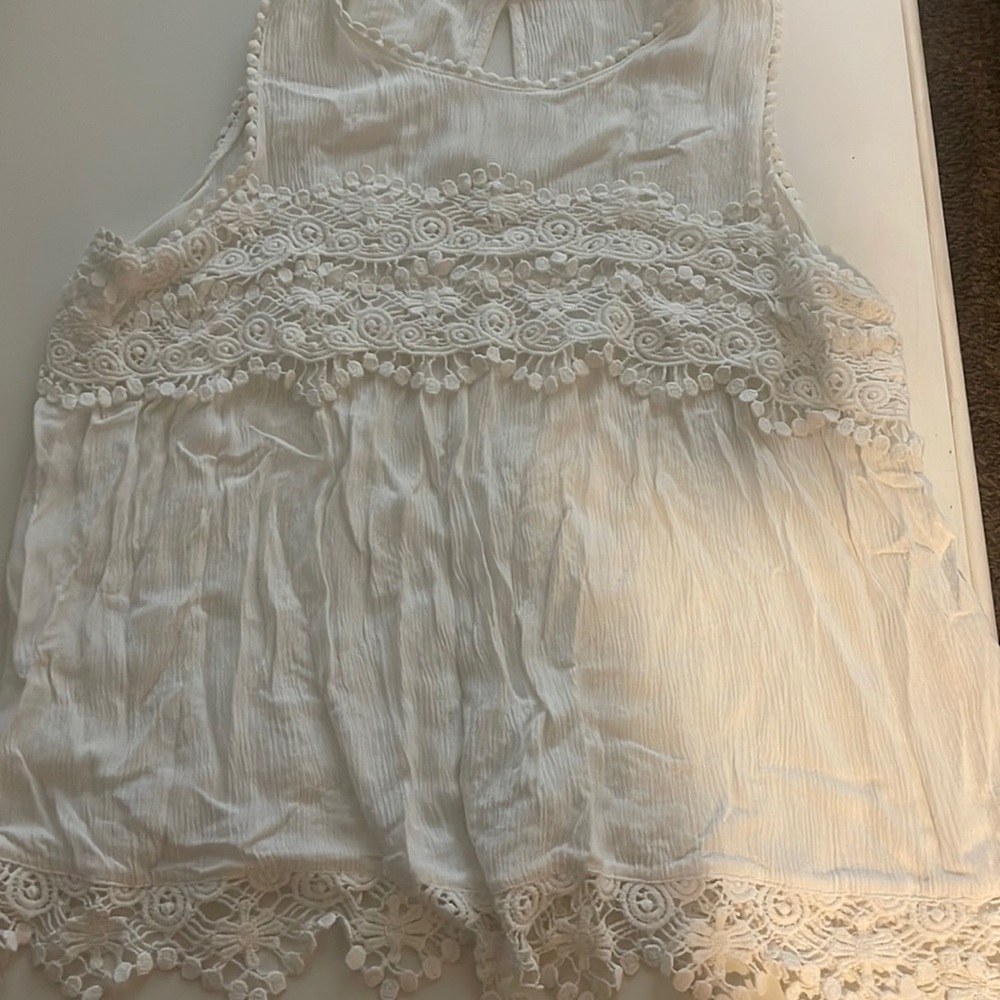 Maurice’s Crocheted white sleeveless top.